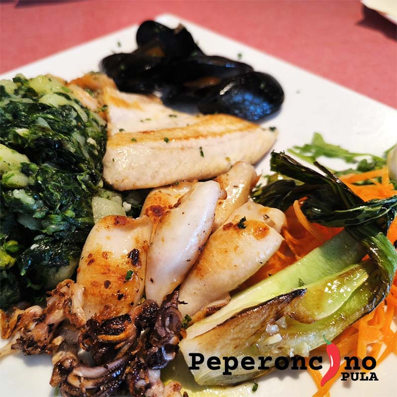 The best boneless fish platter in Pula – grilled sea bass fillet, shrimp, baby squid and grilled mussels, served with traditional Swiss chard and potatoes. A perfect choice for lovers of fresh Adriatic seafood and Mediterranean cuisine.