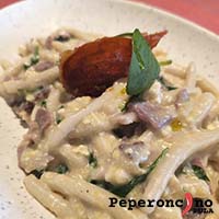 Best homemade pljukanci with Istrian prosciutto, cottage cheese and young spinach in Pula